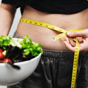 lady checking waist size